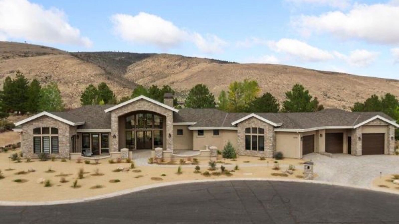 Typical Reno Nevada single-family neighborhood with foothill homes and the Sierra Nevada in the background